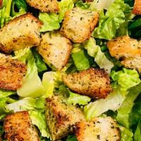 Caesar Salad · Romaine Lettuce, Homemade Croutons and side of Caesar Dressing.