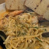 Seafood Pasta · Fresh fish, mussels, clams and shrimp in a spicy cream sauce served over linguini. Served wi...