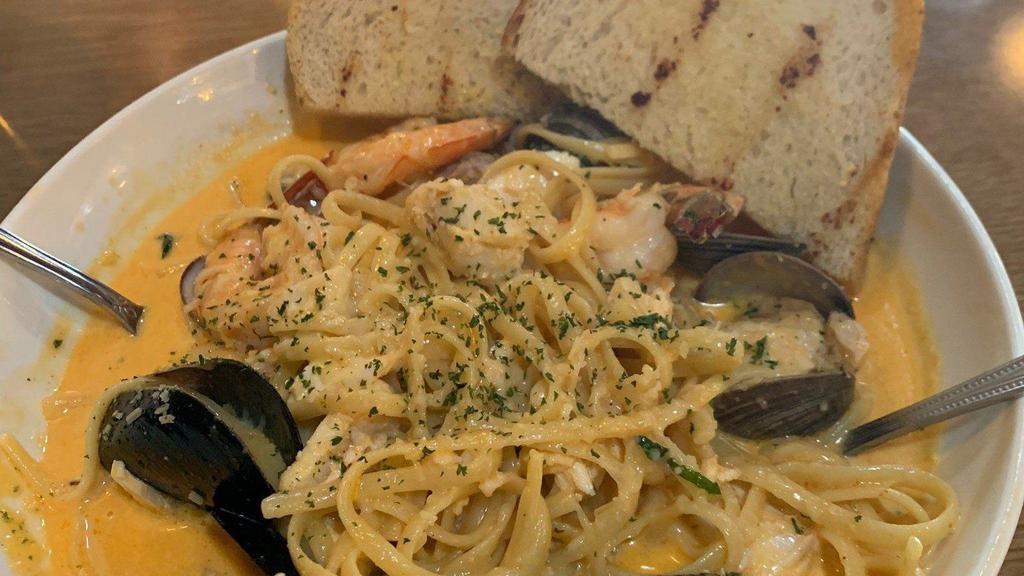 Seafood Pasta · Fresh fish, mussels, clams and shrimp in a spicy cream sauce served over linguini. Served with bread.