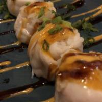 Haliboat · Local halibut wrapped around five balls of sushi rice, topped with sriracha aioli and oven-b...