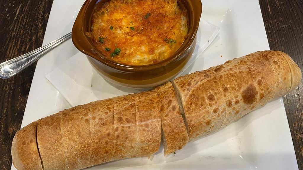 Maryland Crab Dip · Jumbo Lump Crabmeat Blended with Four Cheeses, Scallions,. and Old Bay, Served with Sliced Baguette