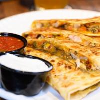 Quesadilla · Large Flour Tortilla stuffed with Cheddar Jack Cheese,. Caramelized Onions, Green Peppers, a...