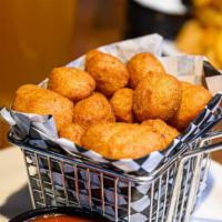 Beer Battered Cheese Bites · White Wisconsin Cheddar lightly battered and fried. Served. with our homemade Marinara Sauce