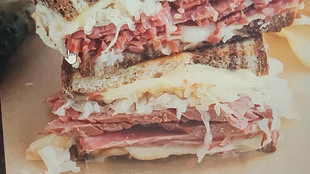 Reuben · Corned Beef or Turkey on Marble Rye Bread with Swiss Cheese, Thousand. Island, and Sauerkraut