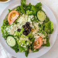 Traditional Mediterranean Salad · Romaine lettuce, cucumber, crumbled feta, olives, tomatoes, and house dressing with pita.