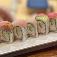 Rainbow · Contains Raw Meat. California Roll topped with Assorted Fish and Avocado
