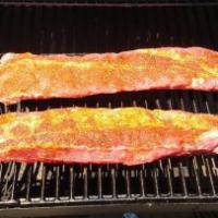 Baby Back Ribs - Full Rack · A Full Rack of Baby Back Ribs - all natural, slow cooked each night in our own smoker. Inclu...