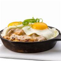 Skillet · Two eggs any style, two ingredients, potatoes, and jack.