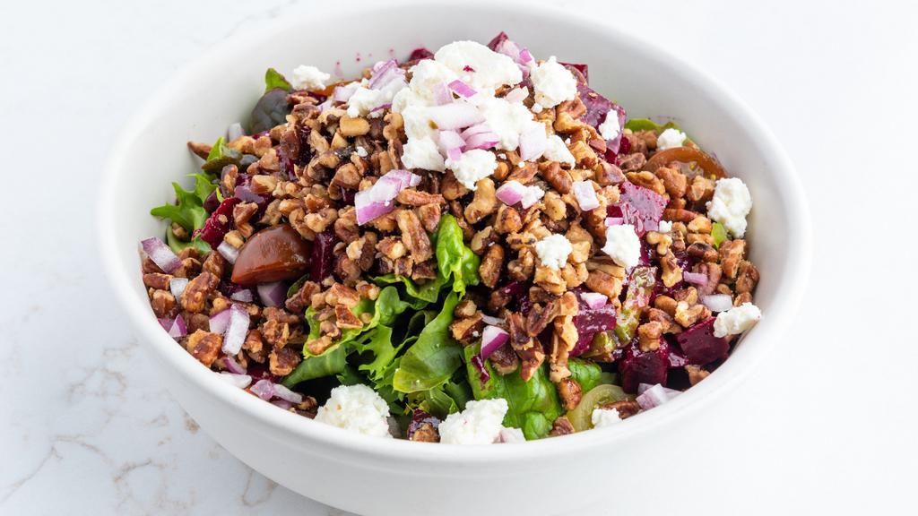 Roasted Beet Salad · Vegetarian.Gluten-free. Mixed greens, marinated beets, tomatoes, caramelized walnuts, red onions, and goat cheese in a balsamic vinaigrette.
