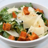 Large Caesar Salad · Romaine lettuce, shaved parmesan,
and croutons in a Caesar dressing.