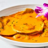 Ravioli · Stuffed with spinach and ricotta cheese, served in a vodka sauce.