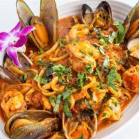 Linguine Seafood · Shrimp, clams, mussels, and calamari served in a white wine tomato herb sauce.
