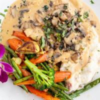 Chicken Marsala · Sautéed in a marsala wine sauce, topped with mushrooms. Served with mashed potatoes and saut...