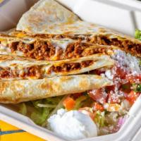Flour Quesadillas · A grilled 12 inch flour tortilla with melted Oaxaca cheese.  Served with a Mexican salad.