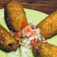 Jalapeño Poppers · An order of four jalapeño poppers stuffed in-house, these are not like other popper you've h...