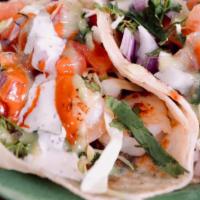 Shrimp Soft Tacos · Corn tortilla garnished with cabbage, onions, tomatoes, cilantro, and served with a side of ...