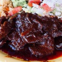 Chili Colorado · Lean pork or chicken smothered with a spicy red sauce mixture of guajilla, ancho, and de arb...