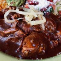 Chicken Mole · Chicken simmered in a traditional deep and smoky sauce with a hint of chocolate.