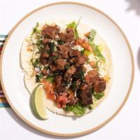 Cecina Taco (3) · Marinated grilled steak taco with roasted red jalapeno, salsa, and sliced avocado