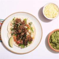 Lomo Taco Taco (3) · Grilled rib eye taco, salsa ranchera, and grilled green onion