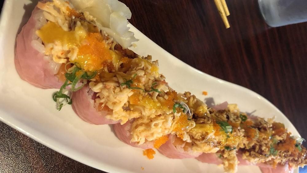 Marble Falls Roll · Contains Raw Fish. Spicy. Salmon, tuna, white fish, avocado inside, wrapped with soy paper, topped with spicy crab meat, crunchy scallion, fish egg.