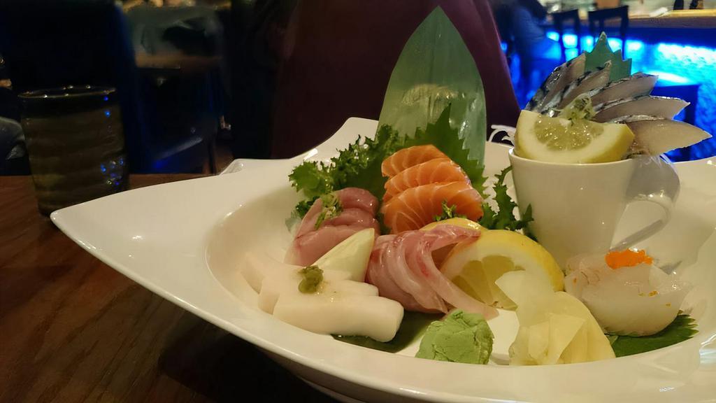 Sashimi Deluxe · Contains Raw Fish. Fifteen pieces of assorted chef's choice sashimi with white rice.