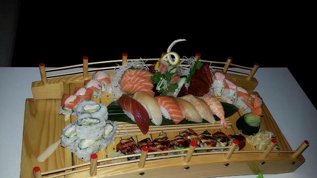 Love Boat For Two · Contains Raw Fish. Ten pieces sushi and fourteen pieces sashimi with volcano roll and shrimp tempura roll.