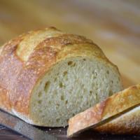 Sourdough Bread · Crusty, lightly sour loaf with a creamy interior that perfectly complements any dinner and m...