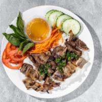 Grilled Pork Rice Bowl · By Banh Mi Viet. Grilled pork, rice, tomato, cucumber and carrot. Gluten-Free. Contains nigh...