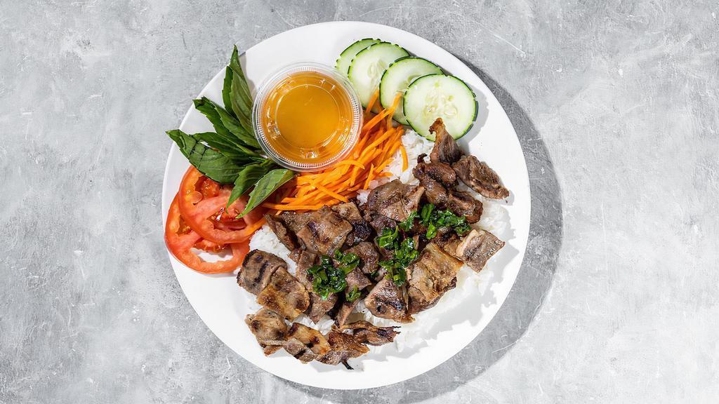 Grilled Pork Rice Bowl · By Banh Mi Viet. Grilled pork, rice, tomato, cucumber and carrot. Gluten-Free. Contains nightshades. We cannot make substitutions