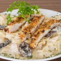 Pasta Mimo · Bowtie pasta tossed with fresh grilled chicken, caramelized sweet onions, roasted portobella...
