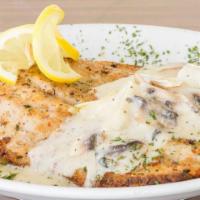 Parmesan Crusted Chicken · With a fresh sage butter sauce. A house favorite!