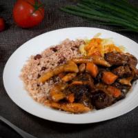 Oxtail Dinner · Stewed oxtail with spinners (dumplings), carrots and lima beans, served with rice and peas a...