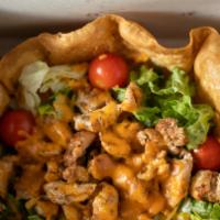Taco Salad · Choice of grilled chicken or carne asada. Beans and salad in a tortilla shell.