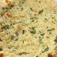 Garlic Naan · Fresh Made naan bread topped with garlic and cilantro