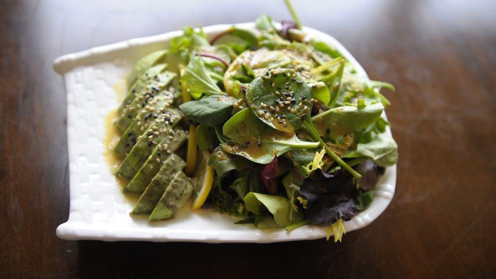 Avocado Salad · Fresh sliced avocado on a bed of field greens with special dressing.