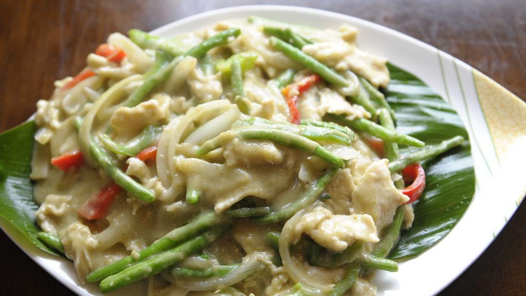 Curry Chicken · Chicken with string beans, red and green peppers, onions, in a green curry sauce. Spicy.