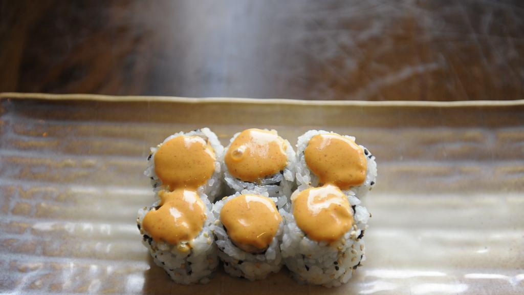 Spicy Tuna Roll · Spicy tuna inside with the sushi rice on the outside and spicy mayo on top, served as 6 pieces.