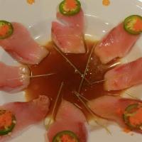 Yellowtail Heaven · 8 pieces yellowtail thin slice with ponzu, jalapeno, radish, sprout, masago on top.