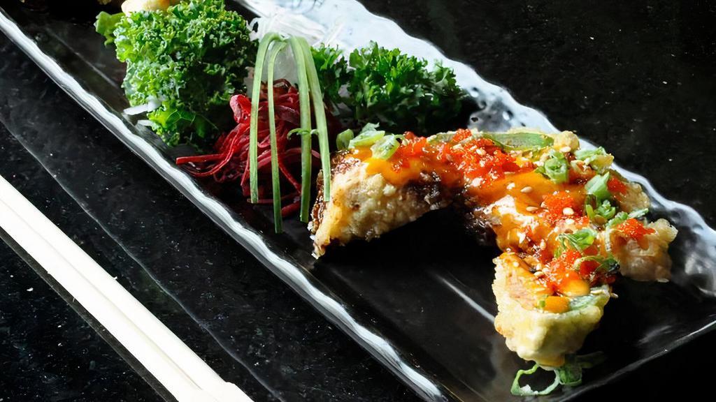Heart Attack · Fried jalapenos with spicy tuna and cream cheese served with masago, scallion, and sesame.