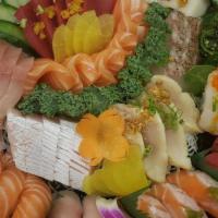 Texas Boat Combination · Chef’s choice of sushi(16), sashimi(24), rolls(4), Seaweed salad, cucumber salad.
