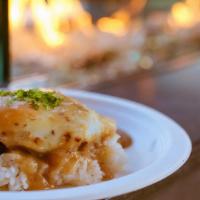 Loco Mocos · Charbroiled Angus beef patty, topped with egg served on a bed of rice, gravy, one scoop of m...