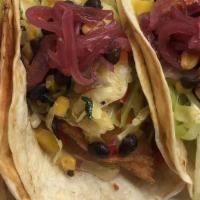 Fish Tacos · Your choice of grilled or fried basa on three soft tortillas, topped with southwestern slaw,...