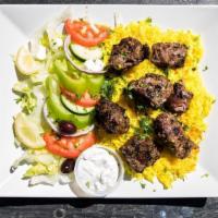 Lamb Kabob Plate · Skewers of marinated lamb tips, charbroiled on open fire to perfection, served with basmati ...