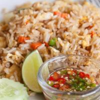 Kow Pad · Egg fried rice with onion, carrots and peas.