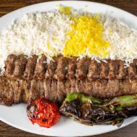 Soltani Kabob · Filet mignon and ground beef, skewered and char-broiled to perfection with grilled tomato an...