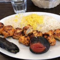 Chicken Kabob · Boneless, fresh chicken tender, tomato and green pepper. Skewered and char broiled, served o...