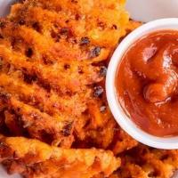 Sweet Potato Fries · Baked Sweet Potato Waffle Fries served with Spicy Ketchup