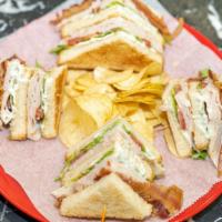 Turkey Club Sandwich · Freshly made with cheese bacon lettuce tomato and mayonnaise layered between toasted bread.