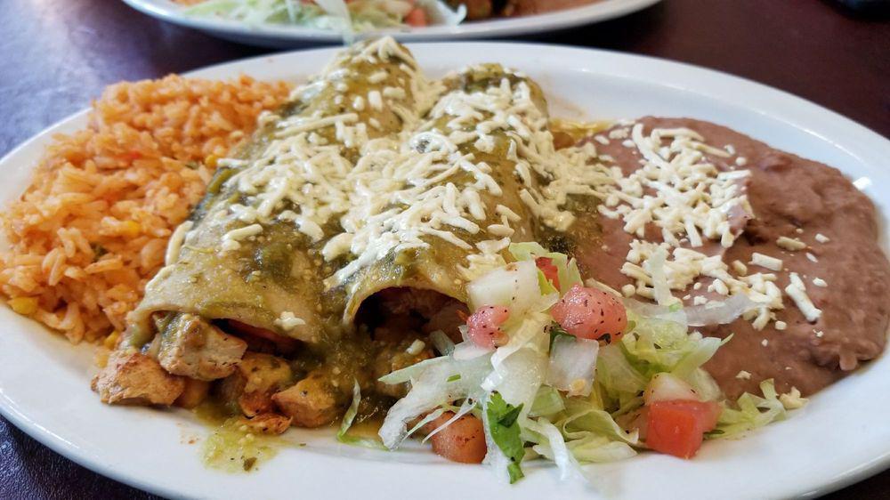 Enchiladas Con Scrambled Tofu (Vegan) · 2 Tofu Enchiladas (cooked with mushrooms, bell peppers, and onions) rolled in corn tortillas topped with ranchera sauce. Served with your choice of side.